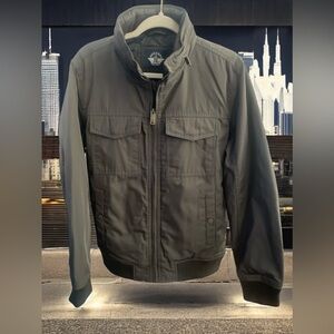 DOCKERS Men’s water resistant jacket with hidden hood. 
Jacket Size Small